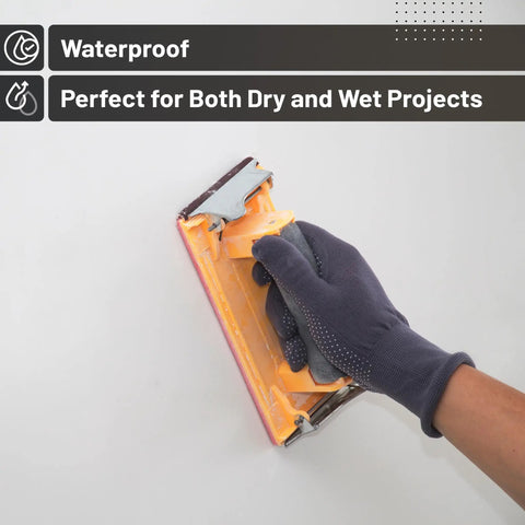 Gloved hand sanding with 18 Piece Wet Dry Sandpaper Kit 120 To 3000 Grit For Metal Wood Automotive And Furniture Includes Two Sheets Each Of 220 320 400 600 800 1000 And One Sheet Of 120 1200 1500 2000 2500 3000 Durable And Flexible For Hand Or Power Sanding