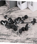 Twenty Adjustable Furniture Leveling Cups With Threaded Socket Design For Quick Install And Slick Glide Motion On Wood Tables Metal Chairs Desks And Bar Stools Zero Hassle Setup For Modern Office Or Laid Back Home Hangouts, showing black plastic and metal leveling cups on a textured surface.