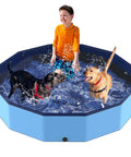 Child and two dogs playing in Foldable 57 Inch Pool For Dogs And Kiddos Non Slip Portable Plastic Tub Wading Pool For Large Dogs And Toddlers Outdoor Backyard Durable PVC Easy Setup Multi Use Splash Bath And Play.