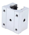SBR16UU 16MM Aluminum Linear Slide Block With Straight Up Smooth Glide Ball Bearing Bushing For Cnc Routers And 3D Printers Plus Heavy Duty Pillow Mount Design And Low Friction Motion close-up view of block with mounting holes and bearing.