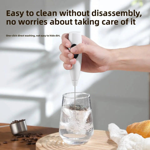 Hand holding USB Rechargeable Milk Frother Handheld 3 Speed Electric Wand With Digital Display For Creamy Cappuccino Latte