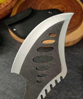 Close-up of Beast Fixed Blade Axe Knife with saw back, featuring a black sheath in the background, for outdoor and survival use.