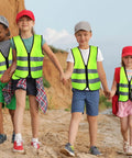 Kids Reflective Safety Vest 20 Pack High Visibility Neon Vests With Zipper For Ages 3 To 10 walking outdoors in a group