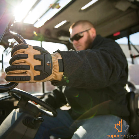 Endura Impact Leather Work Gloves With Water Resistance And Padded Palms worn by worker driving heavy machinery