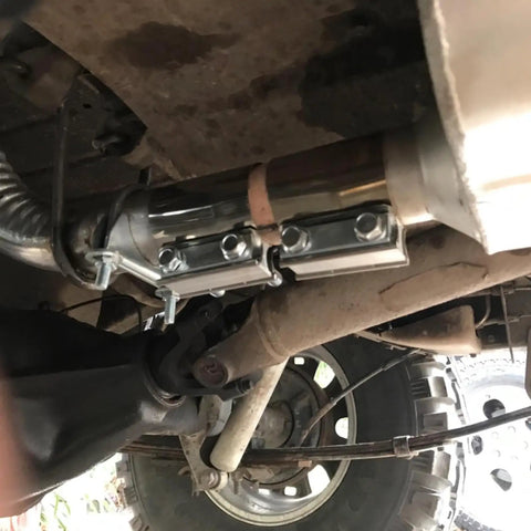 Four Pack 2.5 Inch Stainless Steel Butt Joint Exhaust Clamp Band Sleeve installed on exhaust system under vehicle