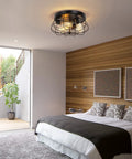 Dope Farmhouse Flush Mount Ceiling Light With Industrial Metal Cage Shade in bedroom setting, 3 Light Black Finish, E26 Base