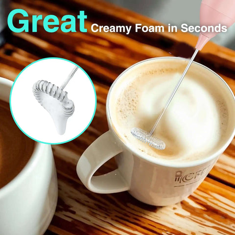 Powerful Rechargeable Milk Frother Wand With Stand in pink whisking coffee foam
