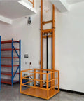 Heavy Duty Hydraulic Lift Platform For Smooth Freight Elevator Transport With Vertical Guide Rail System in warehouse setting.