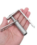 Hand holding Double Swing Saloon Door Hinge With Gravity Return And Self Closing Spring Loaded Mechanism, stainless steel