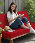 Woman sitting on Waterproof Outdoor Bench Cushion 3 Inch High Density Foam Replacement Seat Pad For Patio Porch Swing 42 By 18 Inches Red