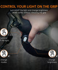 Person adjusting grip controls on handlebar showing PR2400 2400 Lumen Mountain Bike Light With OLED Runtime Display USB Output