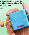 Hella Tough Fiber Optic Buffer Tube Stripper For Mid Span Cable Cutting And No Sweat Optical Wire Stripping Tool With Adjustable Diameter Grooves And Sharpened Steel Blade held in hand with yellow optical fiber