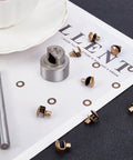 20 Piece Boot Hook Kit With Brass Shoelace Eyelets And Rivets tools set on white surface