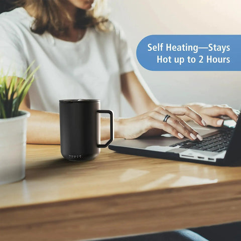Premium Self Heating Rechargeable Coffee Mug With Precise Temperature Control And A Leak Proof Lid Keeps Your Favorite Brew Toasty on a desk.