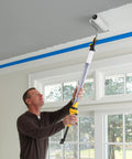 Man using EZ Roller With Long Reach Handle Holds 22 Oz In The Handle Inner Fed Paint Roller Cuts Mess And Paints Interior Walls And Ceilings 2x Faster