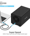 Heavy Duty Four Bay USB C Docking Station For External Hard Drive Enclosure And SSD HDD Expansion With Blazing Fast 10Gbps Transfer Speeds Built Tough Multi Drive Access connected to a laptop.