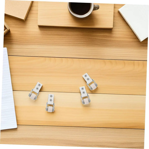 6 Piece White Nylon Sliding Wheels For Furniture Drawers Slick Rolling Track Guide Casters on wooden table with coffee cup.