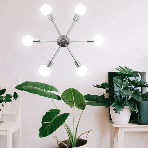 Six Light Sputnik Ceiling Light Fixture in nickel on white wall above plants, for kitchen dining room living space modern mid century style.