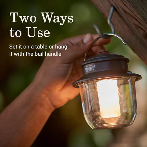 Person using Rechargeable 800 Lumen LED Lantern With Carabiner Handle And USB C Charging Ports For Camping Power Outages And Emergencies.