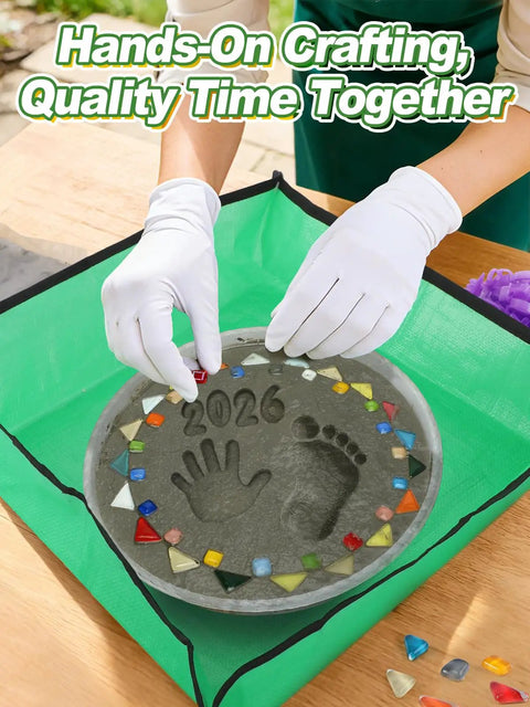 All In One 10 Inch Stepping Stone Kit With Cement Mix Concrete Molds Mosaic Tiles Carving Tools Letter And Number Stamps Gloves And Mat in use, hands placing tiles