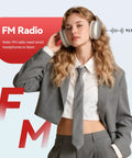 Person wearing over-ear headphones tuned to FM radio, suited in gray. Note: FM radio requires wired headphones.