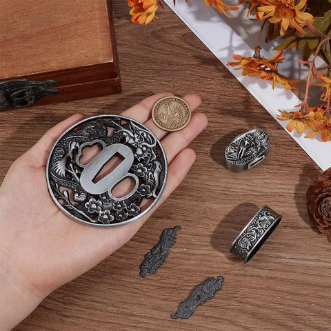 Hand showing Dope Dragon Tsuba Set For Samurai Swords Antique Silver Handguard Kit For Katana Restoration items on table