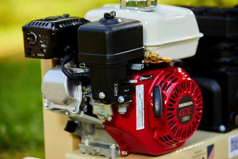 Close-up of Honda engine on 135 Psi 5.5 Hp Gas Powered Air Compressor showcasing cast iron construction and durability.