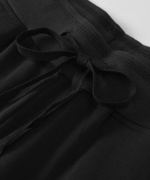 Close-up of drawstring waist on women's cotton sweatpants with pockets in black, cozy lounge pants, comfortable for plus sizes 3X to 4X.