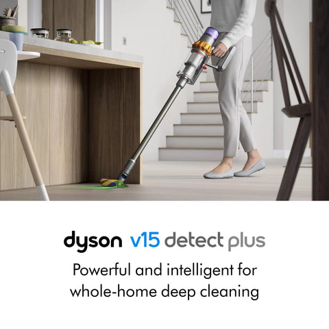 Modern interior with person using V15 Detect Plus Cordless Vacuum With Illumination Revealing Dust, 240AW Suction on hardwood floor.