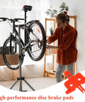 Man using 6 Piece Bike Disc Brake Spacer Set With Piston Reset And Pad Separation Tools on bicycle in workshop