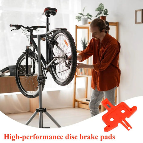 Man using 6 Piece Bike Disc Brake Spacer Set With Piston Reset And Pad Separation Tools on bicycle in workshop