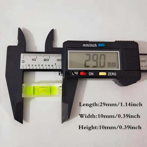 6Pcs Small Bubble Level 10x10x29mm Mini Square Spirit Level Picture measured with caliper at 29mm length, showing bright yellow liquid.