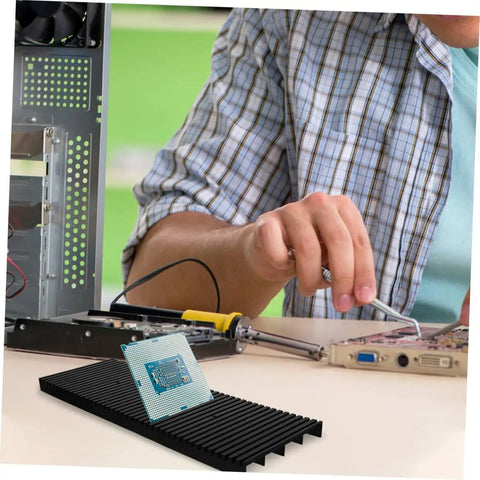 Two Piece Static Bar Rack Kit With Strips And PCB Feet, ESD Wrist Strap Grounding Kit on a workbench with circuit board in use