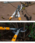 Heavy-Duty Gear-Bypass Lopper With 27 To 40 Inch Adjustable Telescoping Handles, Ratcheting Cut, Cuts Up To 1-3/4 Inches in use