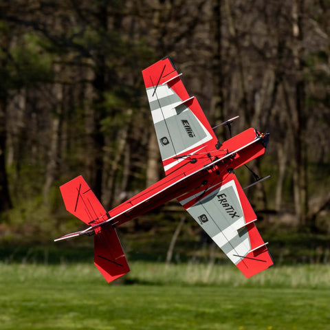 Eratix 3D Flat Foamy 860mm Ready To Fly RC Airplane performing aerobatic maneuver in outdoor field