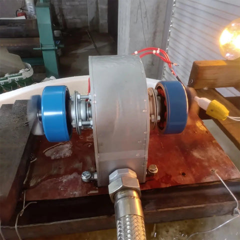 Powerful Portable Micro Hydro Generator 2KW 220V for Home Backup, showing aluminum casing and wires on wooden plank.