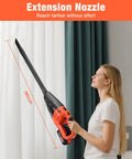 Woman using Grab And Go Cordless Handheld Vacuum With 20V Rechargeable Battery and wet dry suction to clean curtains.