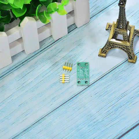 X9C103S Digital Potentiometer Module For Arduino Four Piece Set with connector pins on a wooden surface.