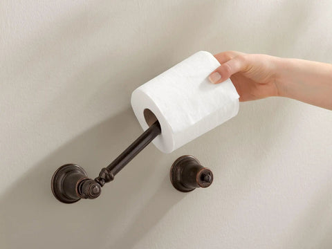 Hand changing roll on Kingsley Pivoting Toilet Paper Holder In Oil Rubbed Bronze With Easy Change Pivot Post For Quick Roll Changes
