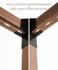Close-up of wood-grain aluminum frame with dual-color solar LED ambient lighting on outdoor pergola.