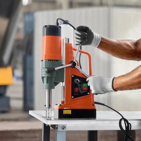 Heavy Duty 1550W Magnetic Drill Press With Powerful 2 Inch Core Bit And 13000N Holding Force For Steel Iron Metals Low Speed 0-550 RPM Reliable Copper Motor Base Stable Performance Jobsite Essential Tool in use on a table.