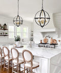 Rustic Black And Gold Finish Four Light Globe Pendant Chandelier With Glass Covers in a modern white kitchen setting