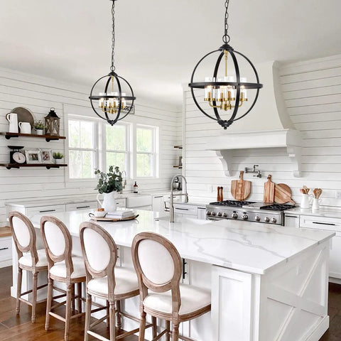 Rustic Black And Gold Finish Four Light Globe Pendant Chandelier With Glass Covers in a modern white kitchen setting