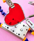 Soldering Clamp For Stained Glass And Jewelry Making, Adjustable Pro Grade Helping Hands holding a red stained glass heart.