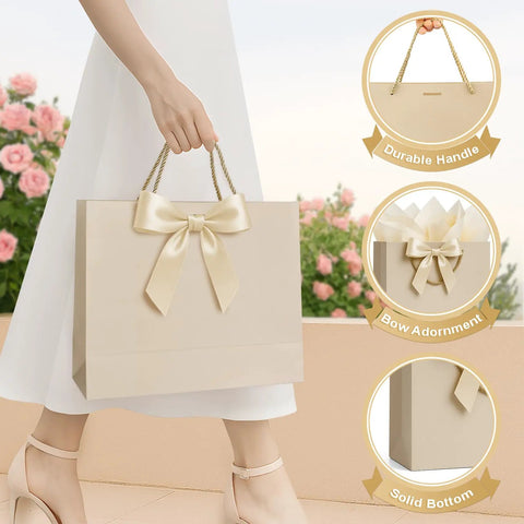 Medium Gift Bags With Handles Set Includes Ribbon Card And Two Tissue Papers For Weddings Birthdays Baby Showers Engagements And Mothers Day Champagne Beige Paper Gift Bags For Party Favors showing durable handle and bow design