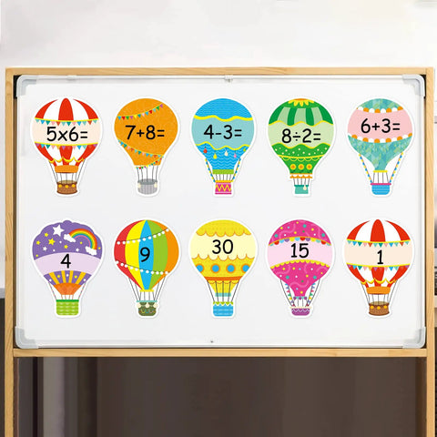 Colorful Hot Air Balloon Cutouts Set for Classroom Decor 36 Pieces in 9 Designs with Glue Dots on bulletin board with numbers.