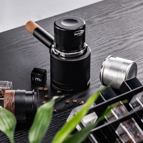 53mm Espresso Tamper Premium Barista Calibrated Spring Loaded One Hundred Percent Stainless Steel Coffee Tamper for 54mm Breville Bottomless Portafilter Silver for Home Barista Use shown in a coffee setup.