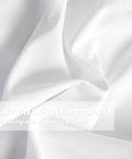 Close-up of soft breathable microfiber material used in the White Blackout Drapes With Handmade Ruffles And Butterfly Flower Accents.