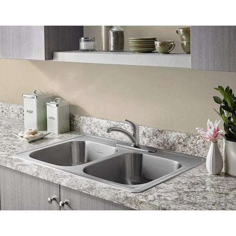 Colony Pro Single-Handle Kitchen Faucet With Deck Plate in stainless steel on a dual sink with modern kitchen style.
