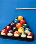 Black Plastic Billiard Rack Set For 8-Ball Triangle And 9-Ball Diamond Fits Standard 2 1/4 Inch Pool Balls with cue stick on blue table